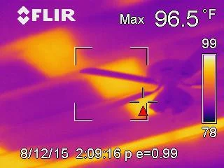 Infrared scan detecting moisture intrusion behind exterior wall during building inspection